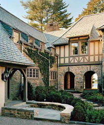 особняк в стиле фахверк в теплых тонах с каменным первым этажом